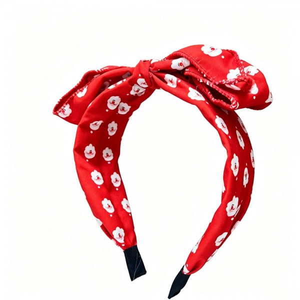 Knotted bow headband in a holiday print, built on a padded band that stays comfortable through a long day of parties and photos. The top knot bow is stitched to keep its shape so it will not droop by the afternoon. An easy festive finish for Christmas mornings, classroom parties, and family portrait sessions. Seasonal headbands sell out fast once holiday displays go up and they reorder well.