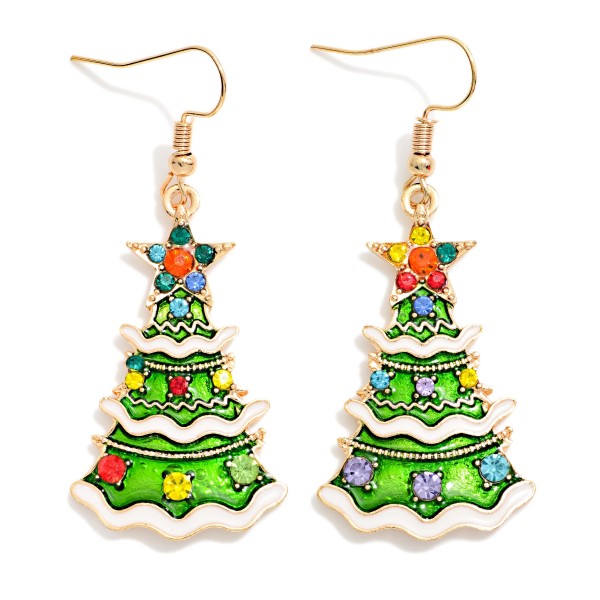 Enamel Christmas Tree Drop Earrings with layered, snow dusted branches, a sparkling star topper, and scattered rhinestone ornaments that glint with every move. Lightweight fishhook wires keep them easy to wear from morning to evening, so they work for office parties, church events, and family dinners alike. A classic holiday shape that customers reach for year after year. Fun, giftable, and easy to merchandise on a seasonal spinner or right by the register.
