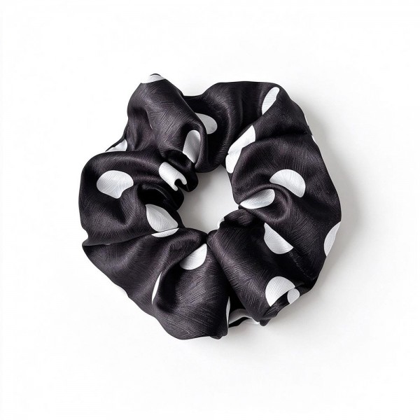 Polka Dot Satin Scrunchie with a smooth, silky finish and a soft elastic core that holds ponytails and buns without creasing or tugging. The full, gathered shape adds instant polish to a simple ponytail and doubles as a cute wrist accessory. Gentle on hair for everyday wear, workouts, and sleep. An easy, affordable add on that customers love to grab in every print.