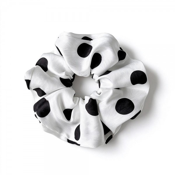 Polka Dot Satin Scrunchie with a smooth, silky finish and a soft elastic core that holds ponytails and buns without creasing or tugging. The full, gathered shape adds instant polish to a simple ponytail and doubles as a cute wrist accessory. Gentle on hair for everyday wear, workouts, and sleep. An easy, affordable add on that customers love to grab in every print.