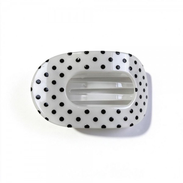 Polka Dot Flat Claw Clip with a glossy finish, an oval open center, and strong interlocking teeth. The low profile shape lies flat against the head, so it stays comfortable when leaning back in the car, on the couch, or at a desk. Great for twists, half up looks, and quick everyday updos. A must have hair accessory at an easy price that customers grab in multiples.