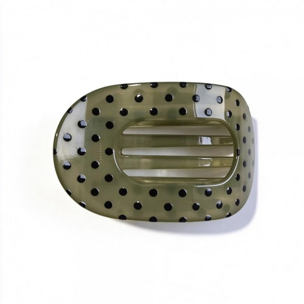 Polka Dot Flat Claw Clip with a glossy finish, an oval open center, and strong interlocking teeth. The low profile shape lies flat against the head, so it stays comfortable when leaning back in the car, on the couch, or at a desk. Great for twists, half up looks, and quick everyday updos. A must have hair accessory at an easy price that customers grab in multiples.
