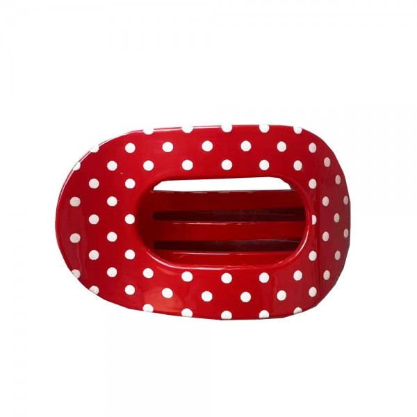 Polka Dot Flat Claw Clip with a glossy finish, an oval open center, and strong interlocking teeth. The low profile shape lies flat against the head, so it stays comfortable when leaning back in the car, on the couch, or at a desk. Great for twists, half up looks, and quick everyday updos. A must have hair accessory at an easy price that customers grab in multiples.