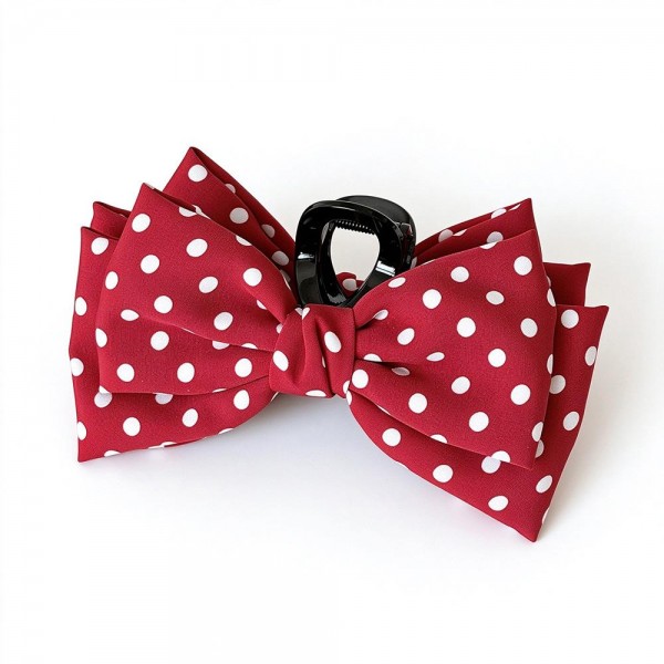 Polka Dot Bow Claw Clip featuring a layered fabric bow in a classic dot print mounted on a sturdy mini claw. It secures half up styles, low buns, and braids in seconds while adding a playful vintage touch. Perfect for school days, brunch dates, and holiday photos. An on trend bow accessory that sells quickly as a register add on and makes an easy stocking stuffer.
