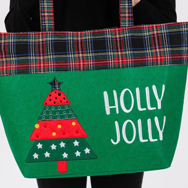 Felt Embroidered 'Holly Jolly' & Christmas Tree Tote Bag With Plaid Detail 
- Lined Inside 
- One Open Pocket 
- Approximately 19.5" L X 13.5" T X 6.5" D
- Strap Drop 8.5" L
- 100% Polyester