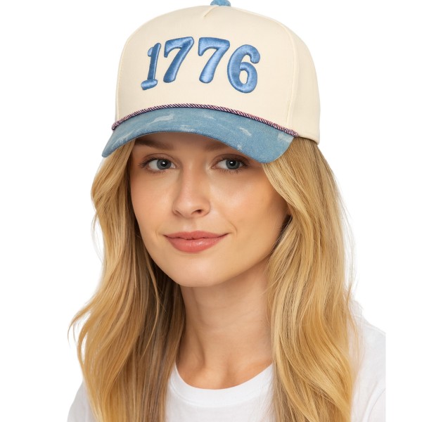Channel timeless Americana with this structured snapback hat showcasing a bold "1776" patch embroidered front and center. The two-tone crown features a soft cotton-blend top paired with a contrasting chambray-style brim, finished with a curved visor and an adjustable back closure for a comfortable fit on most head sizes. Patriotic but never overdone, this everyday cap is a year-round retail winner — built for Fourth of July displays, summer festivals, college tailgates, and small-town main street style. A standout addition to any boutique stocking lifestyle accessories or gifting essentials.