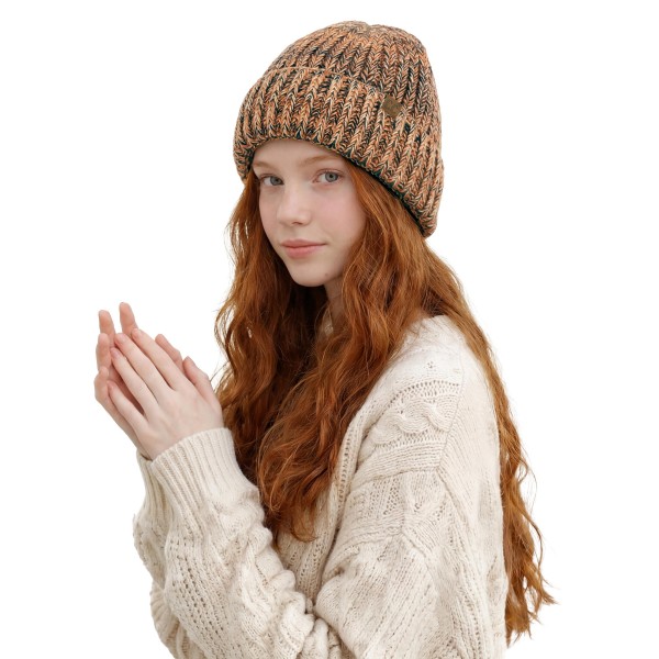 Cuffed knit beanie in a chunky marled yarn with a deep fold over brim that covers the ears and sits low on the forehead. The heathered twist gives dimension that flat solids cannot match, and it hides everyday wear well through a long season. Stretches to fit most head sizes and holds its shape from November to March. Knit beanies turn faster than almost anything else on a cold weather display.