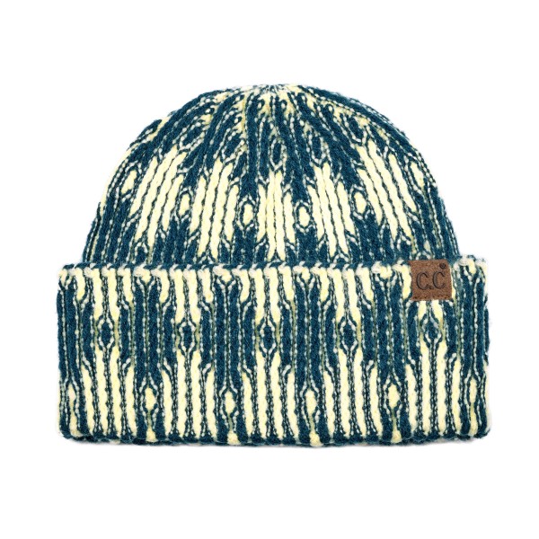 Cuffed knit beanie in a two tone diamond pattern with a deep fold over brim that sits low across the forehead and covers the ears. The chunky rib knit has enough stretch for most head sizes without losing its shape after a wash. A patterned take on the cuffed beanie that stands out beside the solids already on the rack. Knit beanies are the highest turning cold weather accessory most shops carry.