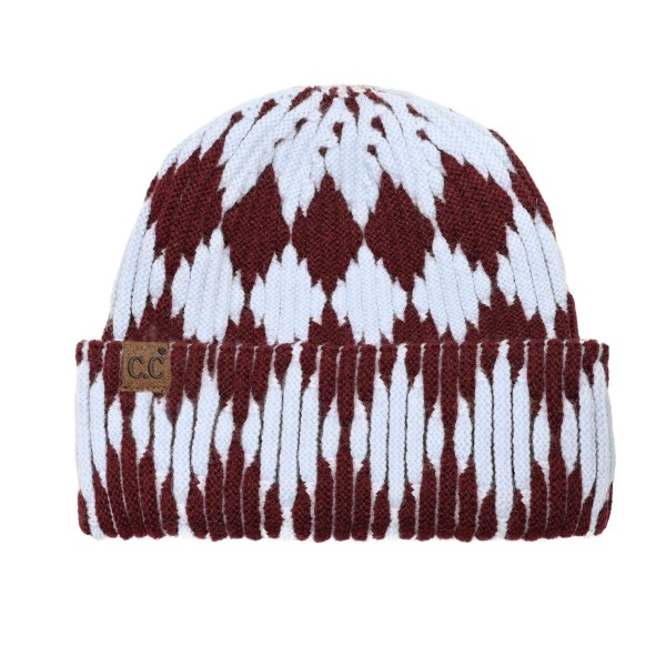 Cuffed knit beanie in a two tone diamond pattern with a deep fold over brim that sits low across the forehead and covers the ears. The chunky rib knit has enough stretch for most head sizes without losing its shape after a wash. A patterned take on the cuffed beanie that stands out beside the solids already on the rack. Knit beanies are the highest turning cold weather accessory most shops carry.