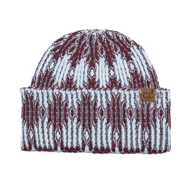 Cuffed knit beanie in a two tone diamond pattern with a deep fold over brim that sits low across the forehead and covers the ears. The chunky rib knit has enough stretch for most head sizes without losing its shape after a wash. A patterned take on the cuffed beanie that stands out beside the solids already on the rack. Knit beanies are the highest turning cold weather accessory most shops carry.