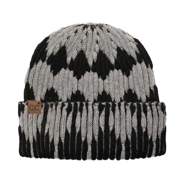 Cuffed knit beanie in a two tone diamond pattern with a deep fold over brim that sits low across the forehead and covers the ears. The chunky rib knit has enough stretch for most head sizes without losing its shape after a wash. A patterned take on the cuffed beanie that stands out beside the solids already on the rack. Knit beanies are the highest turning cold weather accessory most shops carry.