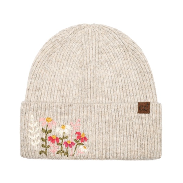 Bring a touch of cottage charm to cold weather style with this floral embroidered knit beanie, featuring a sweet cluster of stitched wildflowers on a fold over cuff and a small leather look patch for a polished finish. The soft heathered knit offers a snug, stretchy fit that keeps you warm without the bulk. An easy everyday layer for fall and winter that pairs perfectly with sweaters and puffers, and a thoughtful gift for boutiques and gift shops.