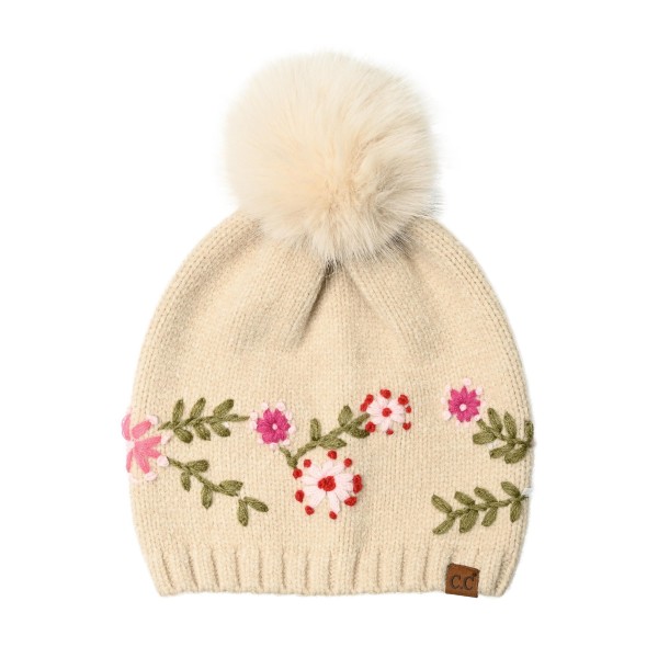 Floral Embroidered Pom Beanie with a stitched vine of tiny blossoms and leaves circling the crown, topped with a fluffy faux fur pom. The soft, stretchy knit keeps a smooth, fitted shape and finishes with a ribbed band that sits comfortably over the ears. A sweet, cottage inspired look for holiday markets, school drop offs, and cozy weekend outings. Embroidered beanies pop on the hat wall and are an easy pick for gift shoppers all season long.