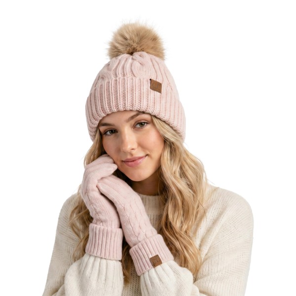 Cable Knit Faux Fur Pom Beanie with a classic braided cable crown, a wide ribbed cuff, and a plush natural tipped faux fur pom. The soft, stretchy knit fits most adults and folds up for extra warmth over the ears. Perfect for ski lodges, holiday markets, cold football nights, and everyday winter errands. Timeless cable pom beanies are a year after year best seller and an easy stocking stuffer for teens and moms.