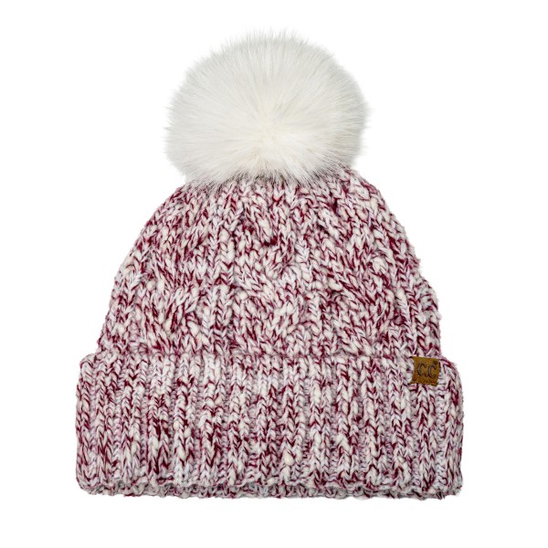 Marled Cable Knit Pom Beanie with a chunky twisted cable texture, a ribbed fold over cuff, and a fluffy faux fur pom on top. The soft heathered yarn has a cozy, handknit look that pairs with puffers, parkas, and wool coats. Perfect for ski trips, holiday markets, school pickups, and everyday winter wear. Pom beanies are a top cold weather seller and an easy stocking stuffer customers buy in multiples.