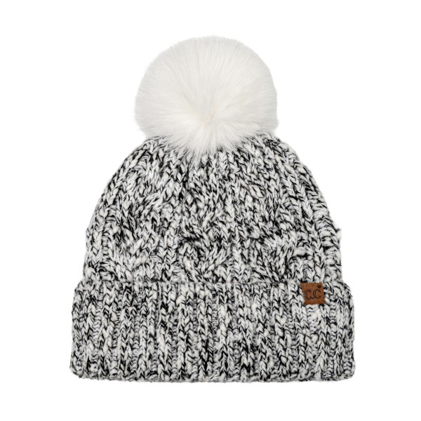 Marled Cable Knit Pom Beanie with a chunky twisted cable texture, a ribbed fold over cuff, and a fluffy faux fur pom on top. The soft heathered yarn has a cozy, handknit look that pairs with puffers, parkas, and wool coats. Perfect for ski trips, holiday markets, school pickups, and everyday winter wear. Pom beanies are a top cold weather seller and an easy stocking stuffer customers buy in multiples.