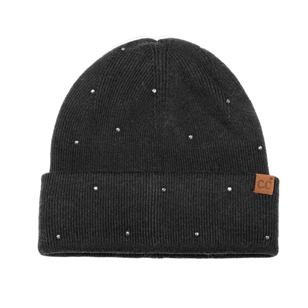 Rhinestone Studded Cuffed Beanie in a soft, fine rib knit dotted with tiny sparkling studs from crown to cuff. The smooth fold over cuff sits neatly at the brow, and a small faux leather patch adds a finished touch. Just enough shine for holiday parties, date nights, and everyday errands. A dressed up take on the classic beanie that sells as a gift and as a closet staple, so it moves quickly on any accessory wall.