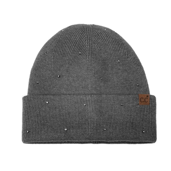 Rhinestone Studded Cuffed Beanie in a soft, fine rib knit dotted with tiny sparkling studs from crown to cuff. The smooth fold over cuff sits neatly at the brow, and a small faux leather patch adds a finished touch. Just enough shine for holiday parties, date nights, and everyday errands. A dressed up take on the classic beanie that sells as a gift and as a closet staple, so it moves quickly on any accessory wall.