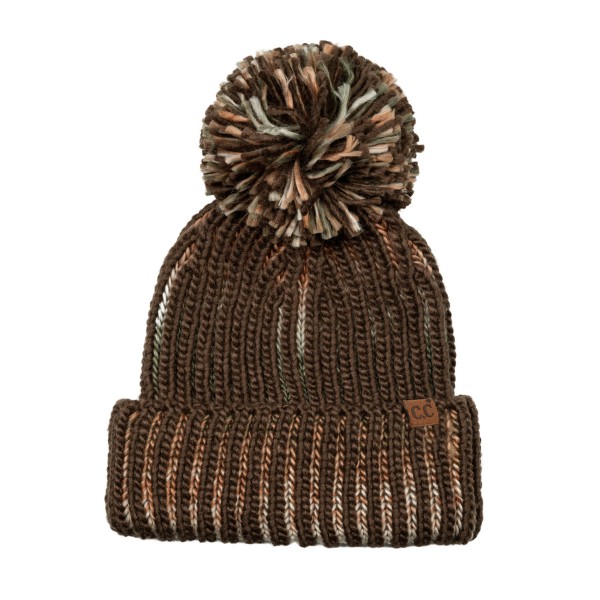 Two Tone Ribbed Pom Beanie knit in a chunky vertical rib with a marled contrast yarn that adds depth to every column. An oversized multi tone yarn pom crowns the top, and the deep fold over cuff keeps ears toasty on the coldest days. Great for ski trips, sledding, and bonfire nights. Bold texture and a big pom give this beanie standout shelf appeal, making it an easy add on for any winter accessory display.