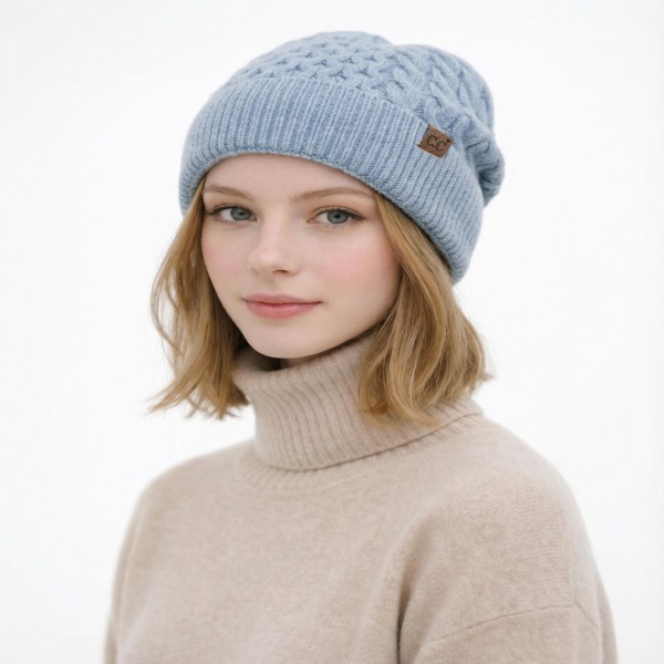 Cable Knit Cuffed Beanie with an allover braided cable pattern and a thick fold over cuff finished with a small faux leather patch. The soft stretch knit hugs the head without squeezing, and the double layer cuff adds extra warmth over the ears. A classic cold weather staple for game days, school runs, ski trips, and holiday gifting. Timeless cable knit beanies are a dependable reorder every fall and winter, so this one earns a permanent spot on the hat wall.