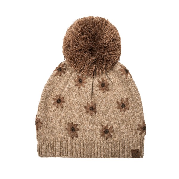 Daisy Knit Pom Beanie with a scattered flower motif knit right into the fabric for a soft, vintage inspired look. A fluffy pom sits on top, and the ribbed band hugs the head for a snug, comfortable fit with no bulky cuff. Sweet for school drop offs, pumpkin patch trips, and holiday markets. Floral knit beanies are a feel good gift that appeals to every age, so this style sells through quickly from fall into winter.