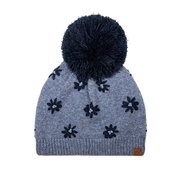 Daisy Knit Pom Beanie with a scattered flower motif knit right into the fabric for a soft, vintage inspired look. A fluffy pom sits on top, and the ribbed band hugs the head for a snug, comfortable fit with no bulky cuff. Sweet for school drop offs, pumpkin patch trips, and holiday markets. Floral knit beanies are a feel good gift that appeals to every age, so this style sells through quickly from fall into winter.