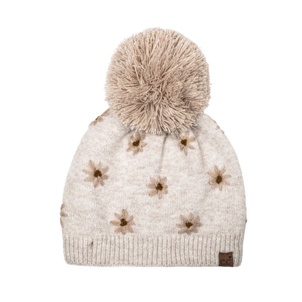 Daisy Knit Pom Beanie with a scattered flower motif knit right into the fabric for a soft, vintage inspired look. A fluffy pom sits on top, and the ribbed band hugs the head for a snug, comfortable fit with no bulky cuff. Sweet for school drop offs, pumpkin patch trips, and holiday markets. Floral knit beanies are a feel good gift that appeals to every age, so this style sells through quickly from fall into winter.