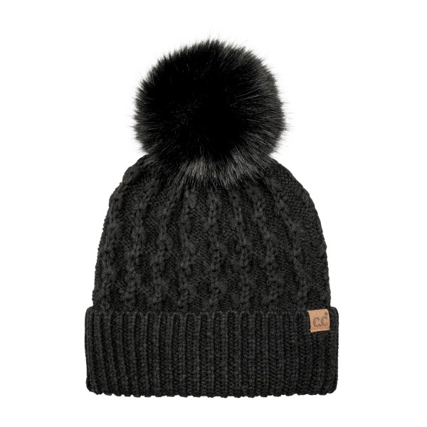 Lattice Cable Knit Pom Beanie with an allover diamond cable texture in a soft heathered yarn, topped with a plush faux fur pom. The ribbed band folds up for a snug double layer over the ears, and a small faux leather patch adds a finished look. A cozy favorite for holiday shopping, tailgates, and snowy weekend walks. Textured pom beanies are a top seller every winter and make an easy, giftable add on at the register.