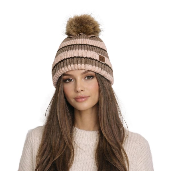 Striped knit pom beanie with a chunky ribbed body, a fold over cuff, and a fluffy faux fur pom on top. The soft, stretchy knit holds its shape and keeps ears covered on cold mornings, game nights, and ski weekends. Bold retro stripes give it a fun, cozy look that works with puffers, flannels, and fleece. A reliable winter bestseller that shoppers grab as a gift or a treat for themselves.