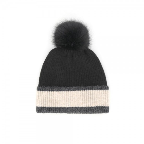 Chunky Knit Pom Beanie with contrast striped cuff and an oversized faux fur pom. The soft, stretchy ribbed knit keeps its shape while delivering cozy warmth on cold-weather days — an effortless topper for errands, game days, and après-ski style. A cold-season bestseller that sells through fast once temperatures drop; boutique customers grab these for themselves and as gifts.