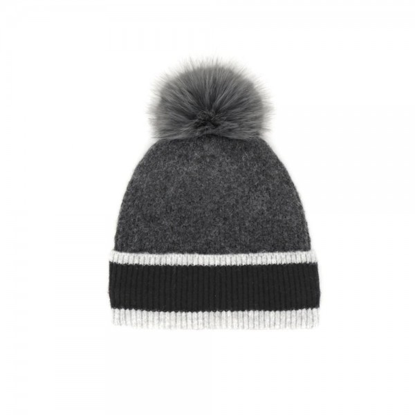 Chunky Knit Pom Beanie with contrast striped cuff and an oversized faux fur pom. The soft, stretchy ribbed knit keeps its shape while delivering cozy warmth on cold-weather days — an effortless topper for errands, game days, and après-ski style. A cold-season bestseller that sells through fast once temperatures drop; boutique customers grab these for themselves and as gifts.