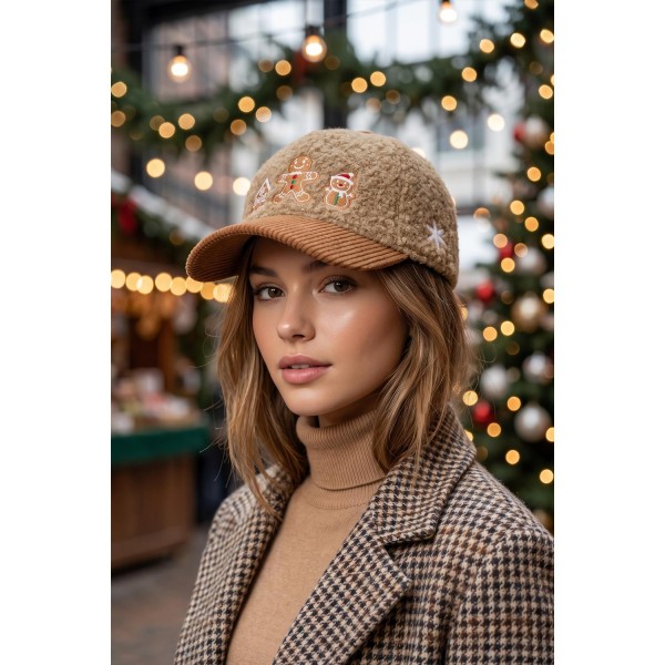 Gingerbread Embroidered Baseball Cap with a soft boucle crown and coordinating corduroy brim. An embroidered gingerbread house, gingerbread man, and gingerbread snowman line the front for a sweet baking season look. An adjustable back strap fits most. Perfect for cookie exchanges, holiday baking parties, and cozy December weekends, and an easy add on at the register.