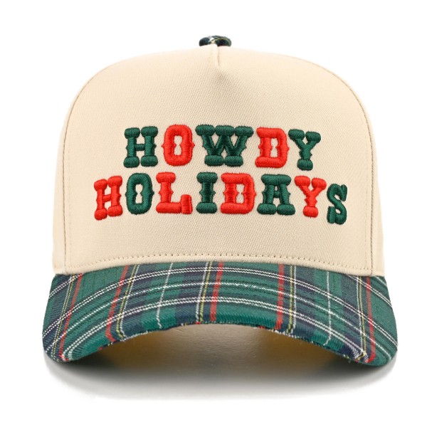 Saddle up for the season with this Howdy Holidays trucker cap, featuring bold embroidered lettering across a structured front panel with breathable mesh in the back. A playful western holiday look that pairs perfectly with cozy sweaters, flannels, and denim. The adjustable snapback closure delivers a comfortable fit for most head sizes, making it an easy gift and a festive seasonal favorite for boutiques and gift shops.