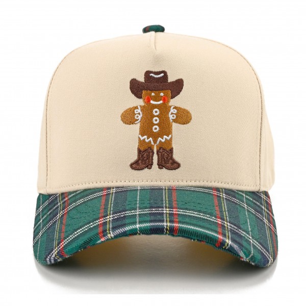 Gingerbread Cowboy Embroidered Baseball Cap featuring a smiling gingerbread man in a cowboy hat and boots stitched on the front panel. The structured crown is paired with a plaid brim and matching plaid top button for a festive, western inspired finish. Perfect for Christmas markets, holiday parties, and cozy winter outfits. A fun seasonal cap that makes an easy gift and sells fast through the holidays.