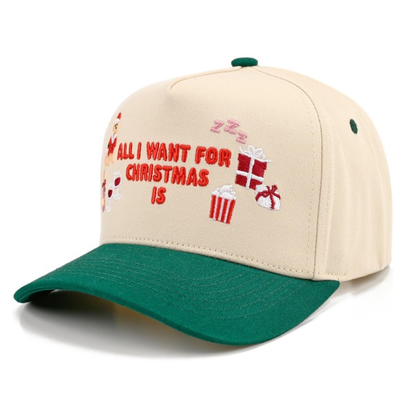All I Want For Christmas Is Baseball Cap with playful embroidered lettering surrounded by wrapped presents and a sleepy Zzz, a cute nod to naps and gifts. A structured cap with a bold contrast brim that brightens up any cold weather outfit. Great for Christmas parties, holiday travel, tree lighting events, and matching family photos. Funny holiday phrase hats sell quickly as gifts and are an easy add on for any Christmas display.