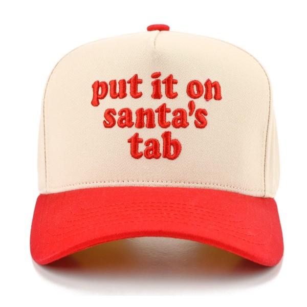 Put It On Santa's Tab Baseball Cap with cheeky embroidered script lettering across the front and a contrast brim for a fun holiday twist. A structured cap that tops off cozy sweaters, shackets, and leggings for an effortless festive look. A hit for holiday shopping sprees, Christmas parties, girls night out, and white elephant gift swaps. Funny Christmas sayings are always a top seller, making this cap an easy grab and go gift at checkout.