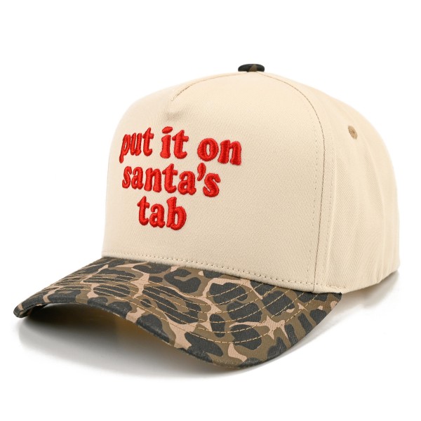 Put It On Santa's Tab Baseball Cap with cheeky embroidered script lettering across the front and a contrast brim for a fun holiday twist. A structured cap that tops off cozy sweaters, shackets, and leggings for an effortless festive look. A hit for holiday shopping sprees, Christmas parties, girls night out, and white elephant gift swaps. Funny Christmas sayings are always a top seller, making this cap an easy grab and go gift at checkout.