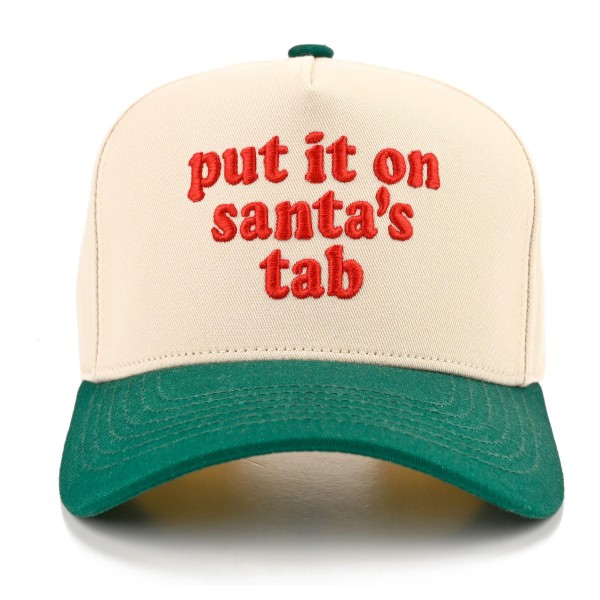 Put It On Santa's Tab Baseball Cap with cheeky embroidered script lettering across the front and a contrast brim for a fun holiday twist. A structured cap that tops off cozy sweaters, shackets, and leggings for an effortless festive look. A hit for holiday shopping sprees, Christmas parties, girls night out, and white elephant gift swaps. Funny Christmas sayings are always a top seller, making this cap an easy grab and go gift at checkout.
