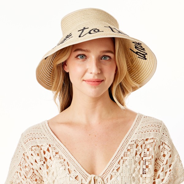 "Talk to the Sand" Straw Roll Up Sun Visor Featuring Bow On Back

- One size fits most
- Adjustable Velcro Closure
- Brim Width: 5"
- 60% Paper / 40% Nylon