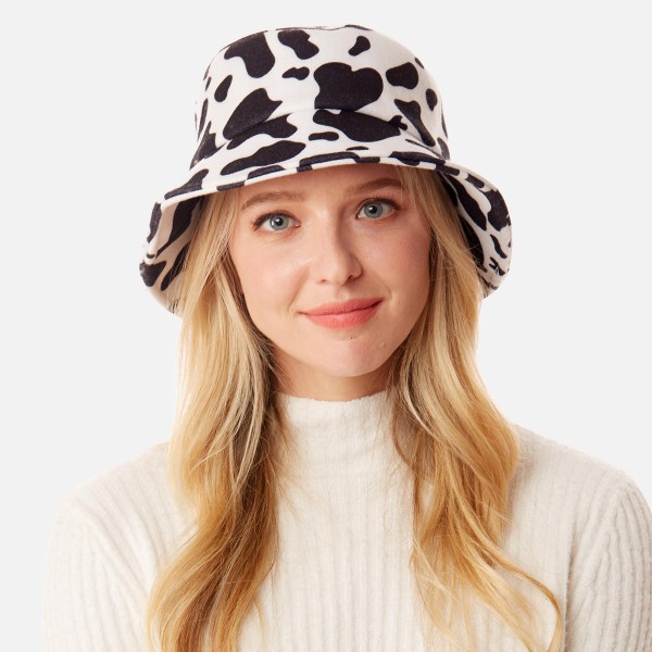 Cow Print Bucket Hat.

- One Size Fits Most
- Adjustable Draw String
- 95% Polyester / 5% Viscose