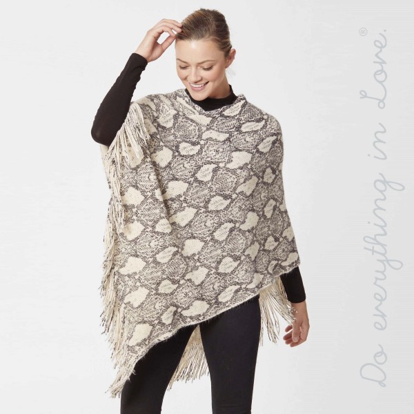 Do everything in Love brand snakeskin knit poncho with fringes