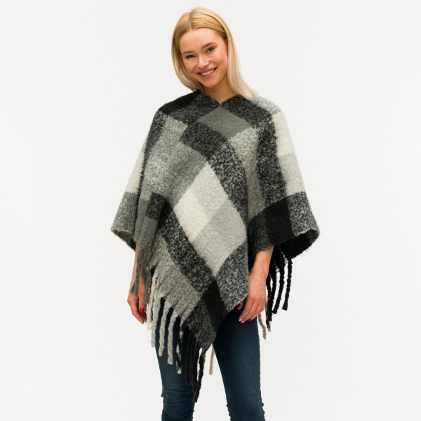 Soft touch plaid poncho with fringes.

- One size fits most 0-14
- Approximately 40" in length
- 40% Acrylic, 60% Polyester