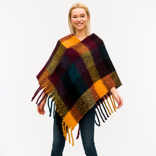 Soft touch plaid poncho with fringes.

- One size fits most 0-14
- Approximately 40" in length
- 40% Acrylic, 60% Polyester