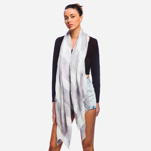 Women's lightweight tie-dye print scarf with frayed edges.

- Approximately 37" W x 72" L
- 20% Cotton, 80% Polyester