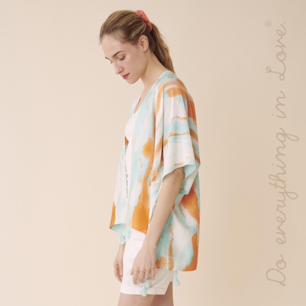 Do everything you Love Brand Short Lightweight Satin Tie-Dye Kimono.

- One size fits most 0-14
- Approximately 29" L
- 100% Polyester