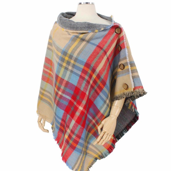 Reversible Tartan Plaid Poncho Featuring Coconut Button Detail.

- One size fits most 0-14
- 100% Acrylic 