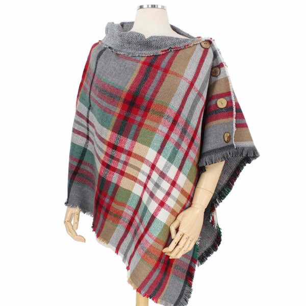 Reversible Tartan Plaid Poncho Featuring Coconut Button Detail.

- One size fits most 0-14
- 100% Acrylic 