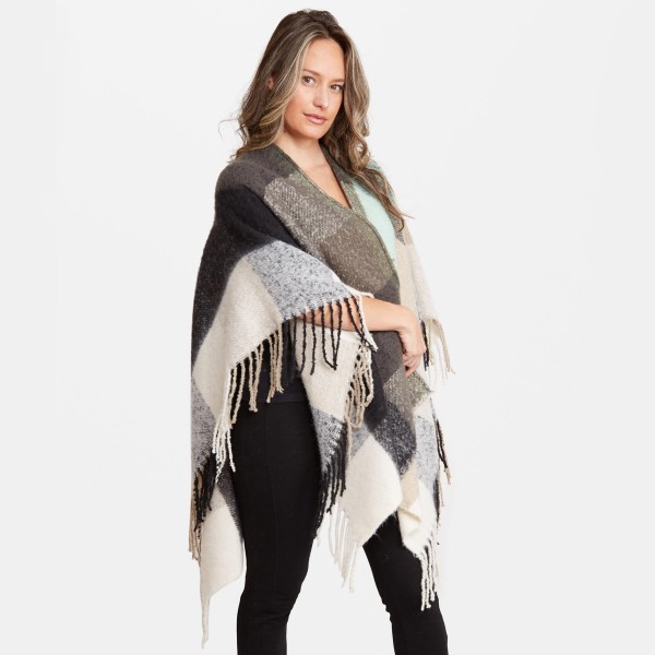 Women's Oversized Fleece Plaid Ruana Featuring Fringe Tassels Trim.

- One size fits most 0-14
- Approximately 33" L 
- 100% Acrylic