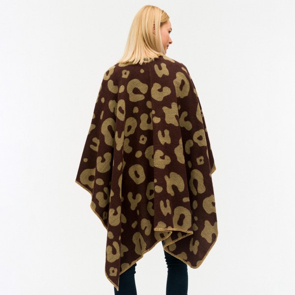 Women's Reversible Leopard Print Ruana/Wrap.

- One size fits most 0-14
- Approximately 32" Long 
- 100% Polyester