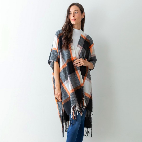Women's Black Plaid Knit Ruana Wrap Featuring Tassel Edges.

- One Size Fits Most (Sizes 0-14)
- Approximately 32" in Length
- 100% Polyester